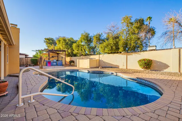 a view of a swimming pool with a lounge chair