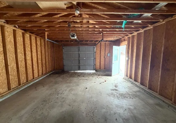a view of a room with wooden walls