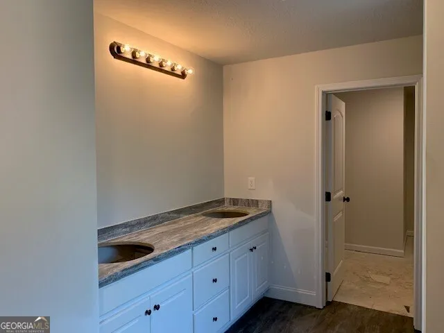 a view of a kitchen with a sink and a stove top oven