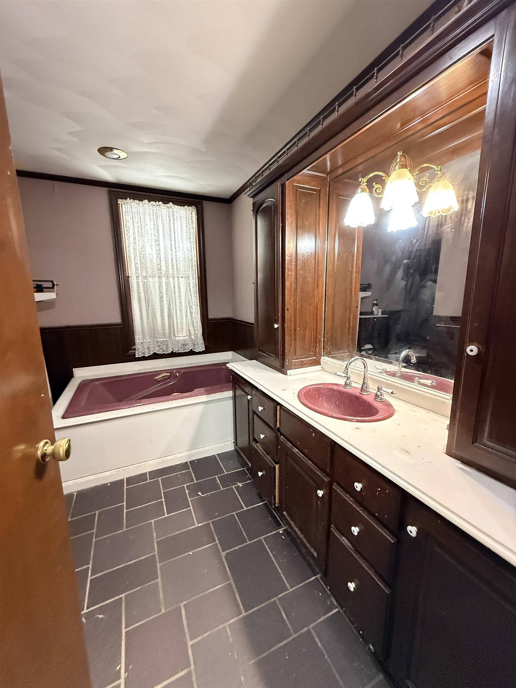 323 South Main Street Stockton, IL 61085 - Photo 21 of 32 a bathroom with a double vanity sink and a mirror