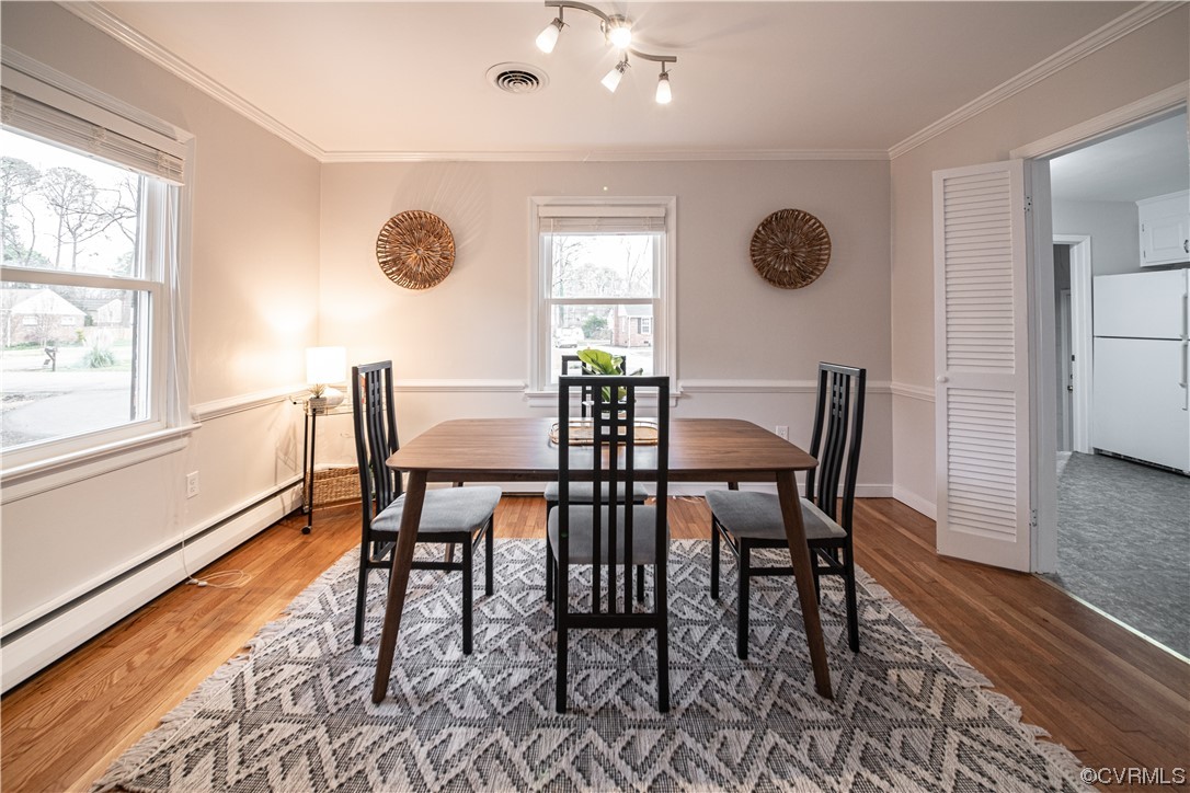 10201 Glendye Road Richmond, VA 23235 - Photo 11 of 50 a view of a dining room with furniture and wooden floor
