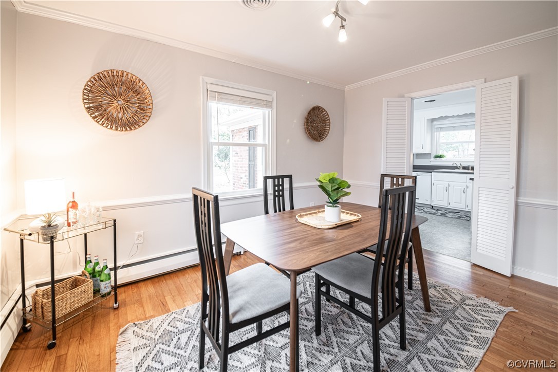 10201 Glendye Road Richmond, VA 23235 - Photo 12 of 50 a view of a dining room with furniture and wooden floor