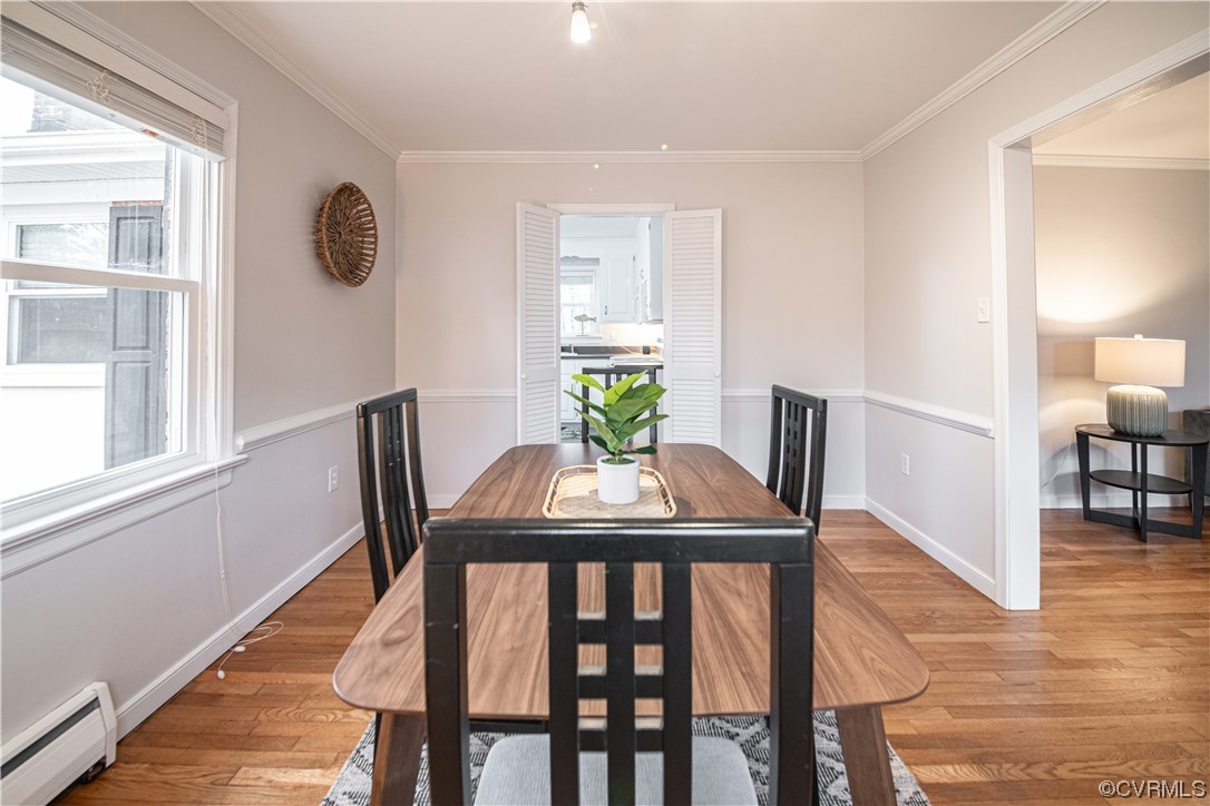 10201 Glendye Road Richmond, VA 23235 - Photo 13 of 50 a view of a dining room with furniture and wooden floor