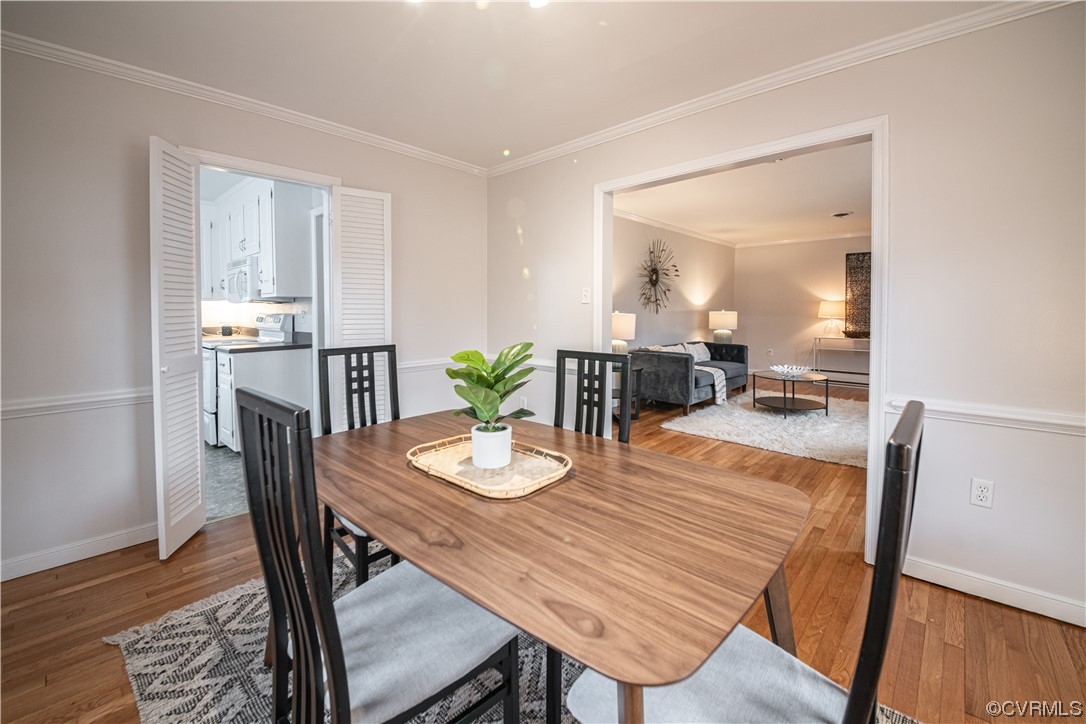 10201 Glendye Road Richmond, VA 23235 - Photo 15 of 50 a view of a dining room with furniture and wooden floor