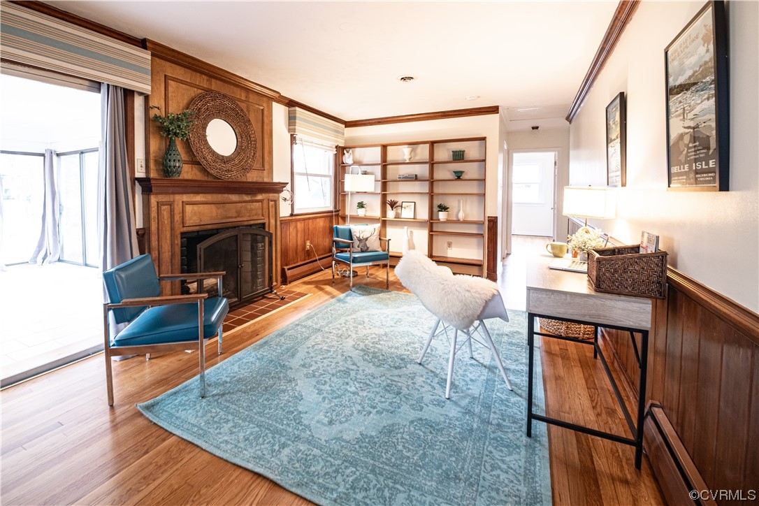 10201 Glendye Road Richmond, VA 23235 - Photo 19 of 50 a living room with furniture a fireplace a flat screen tv and a large window
