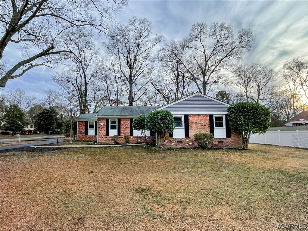 10201 Glendye Road Richmond, VA 23235 - Photo 2 of 50 a front view of a house with garden