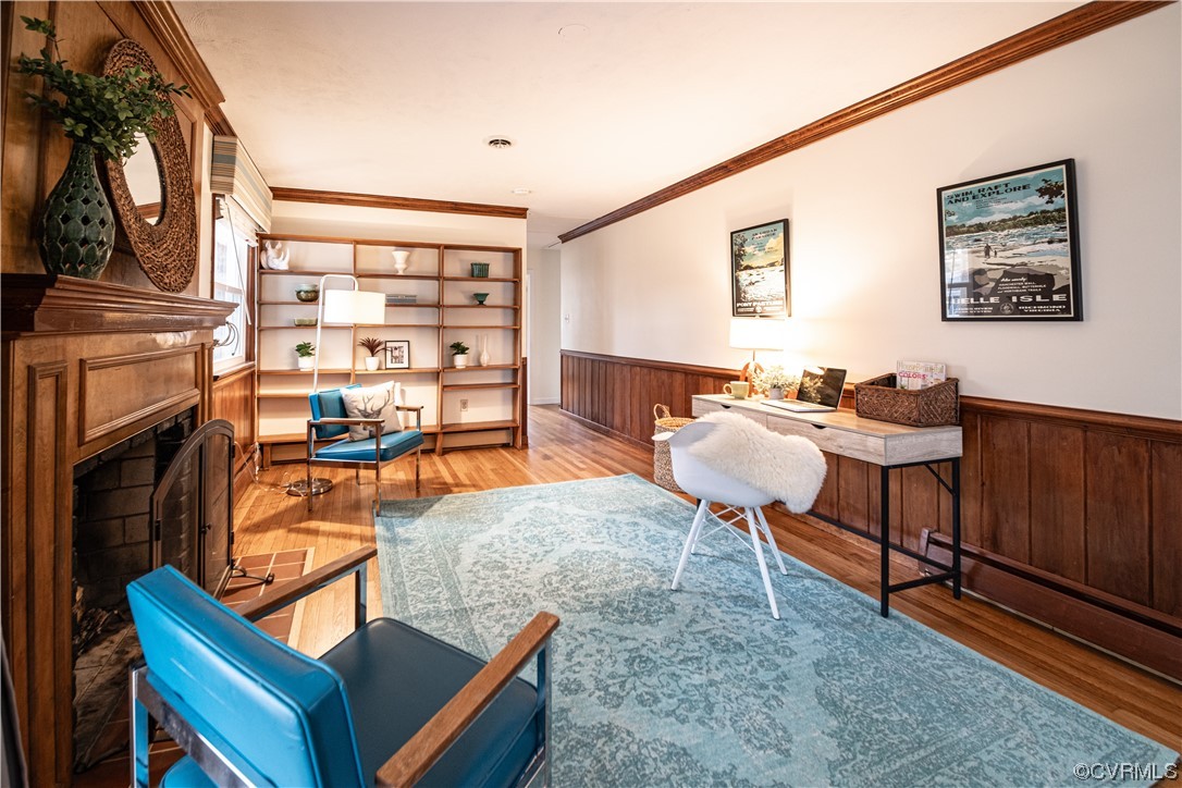 10201 Glendye Road Richmond, VA 23235 - Photo 21 of 50 a living room with furniture a flat screen tv and a fireplace