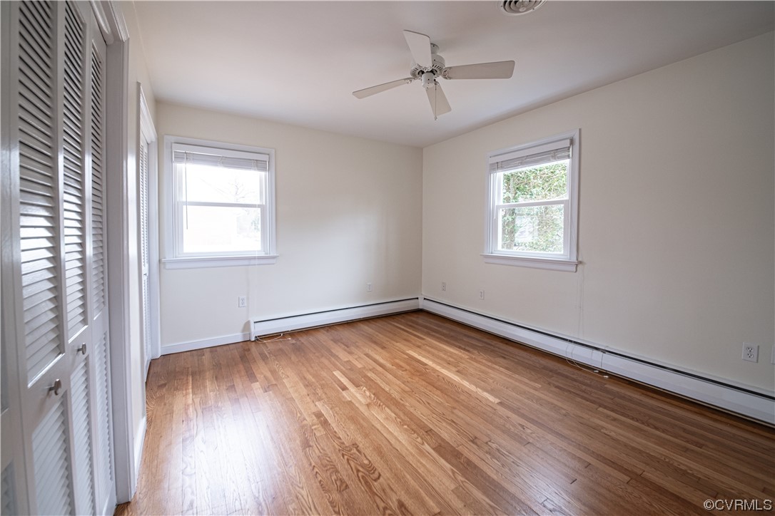 10201 Glendye Road Richmond, VA 23235 - Photo 35 of 50 a view of an empty room with wooden floor and a window