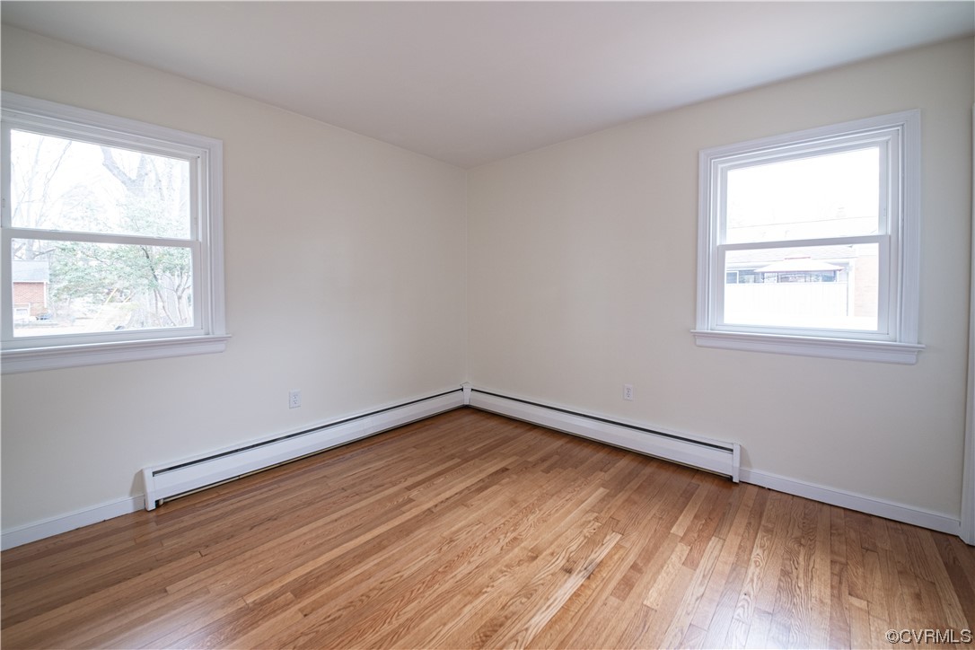 10201 Glendye Road Richmond, VA 23235 - Photo 37 of 50 an empty room with wooden floor and windows