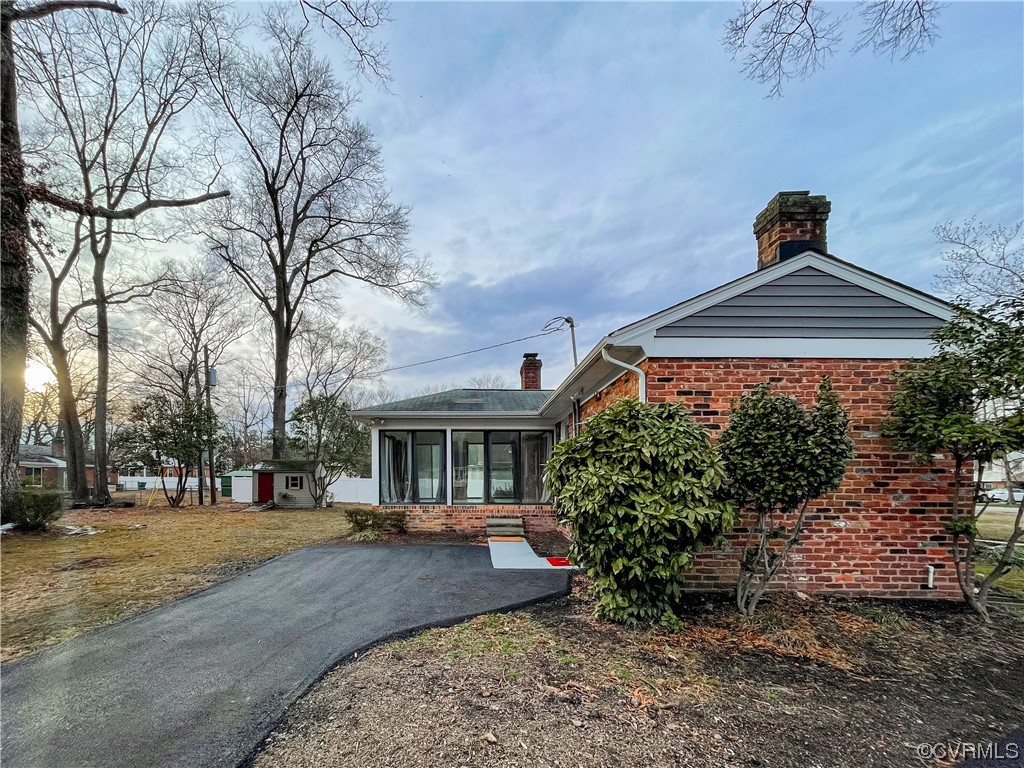 10201 Glendye Road Richmond, VA 23235 - Photo 49 of 50 a front view of a house with a yard