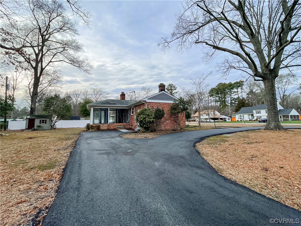 10201 Glendye Road Richmond, VA 23235 - Photo 50 of 50 a front view of a house with a yard and car parked