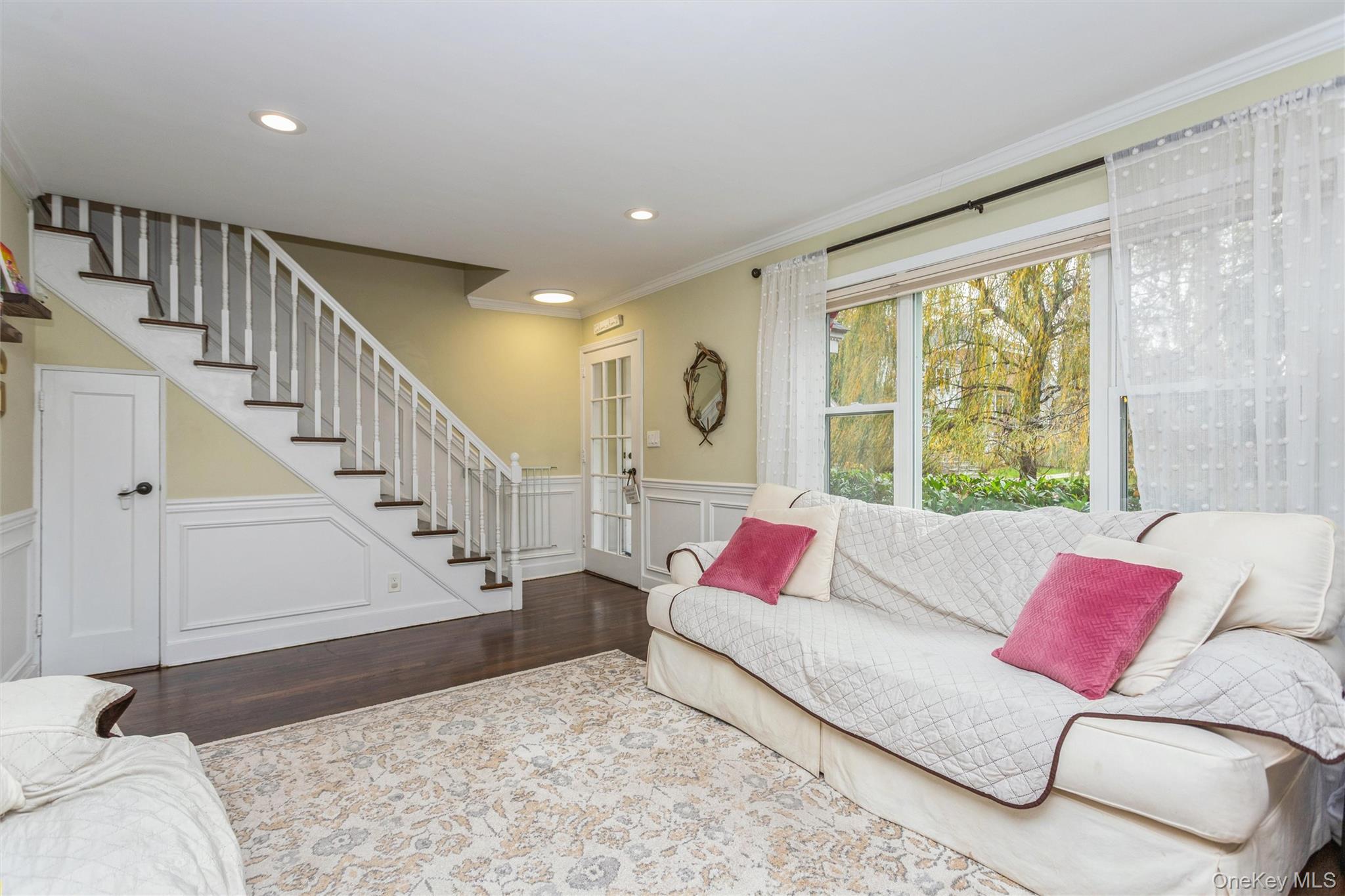 35 Peck Avenue, Unit 35A Rye, NY 10580 - Photo 14 of 27 Living room with dark wood finished floors, stairway, a decorative wall, wainscoting, and recessed lighting
