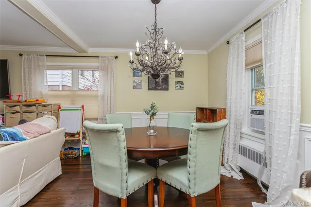 a view of a dining room with furniture and window