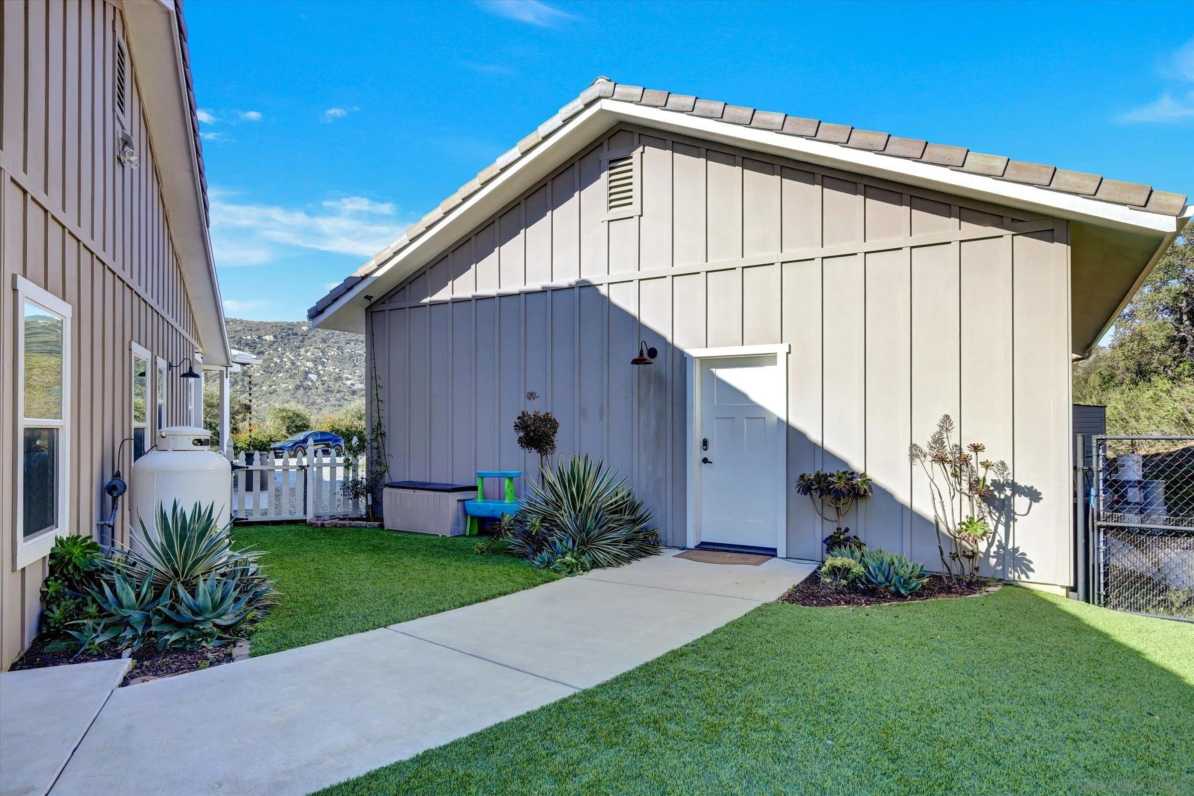 11611 Rancho Heights Road Pala, CA 92059 - Photo 33 of 43 backyard to garage side door