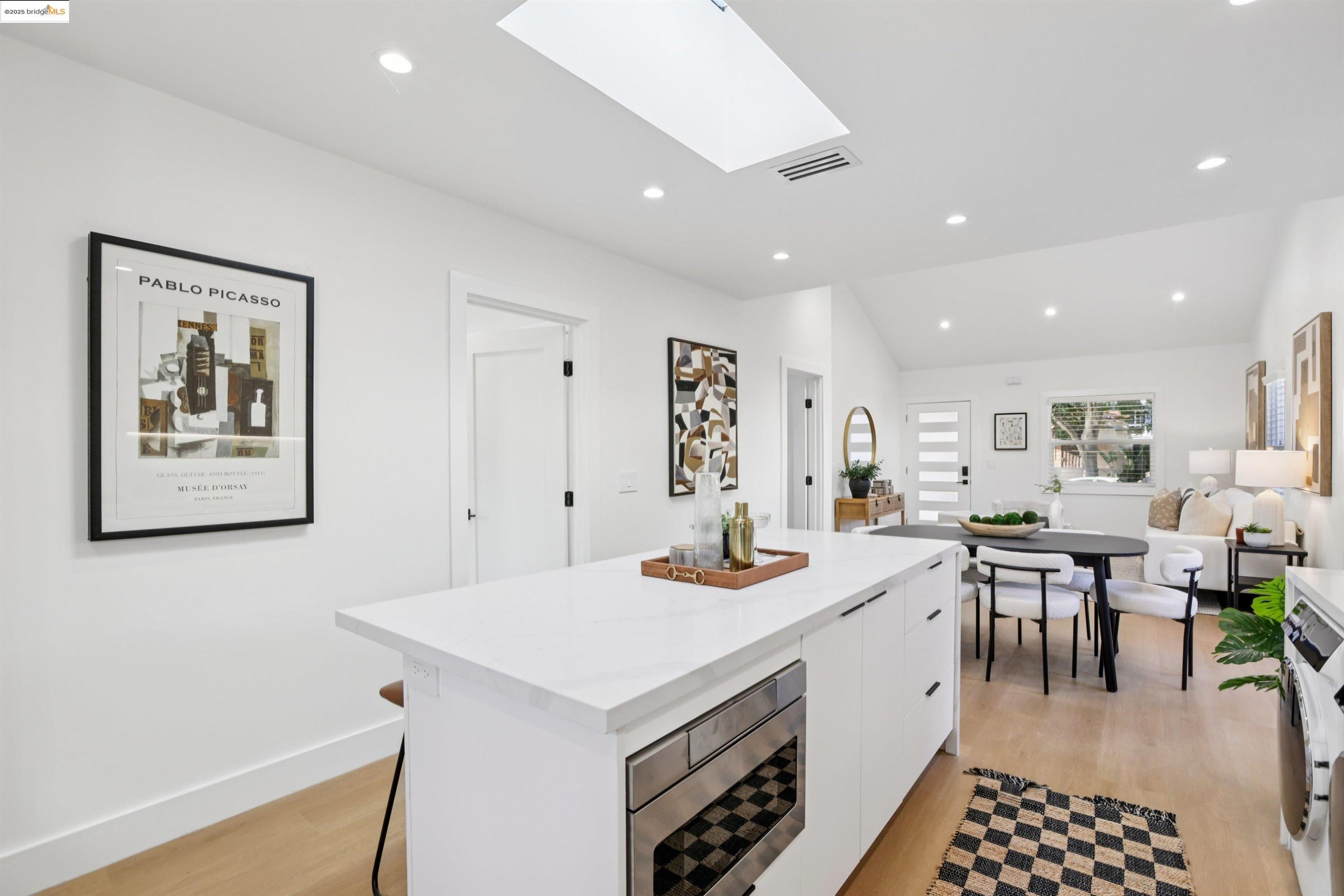 1612 Carleton Street Berkeley, CA 94703 - Photo 17 of 35 a large white kitchen with a table and chairs