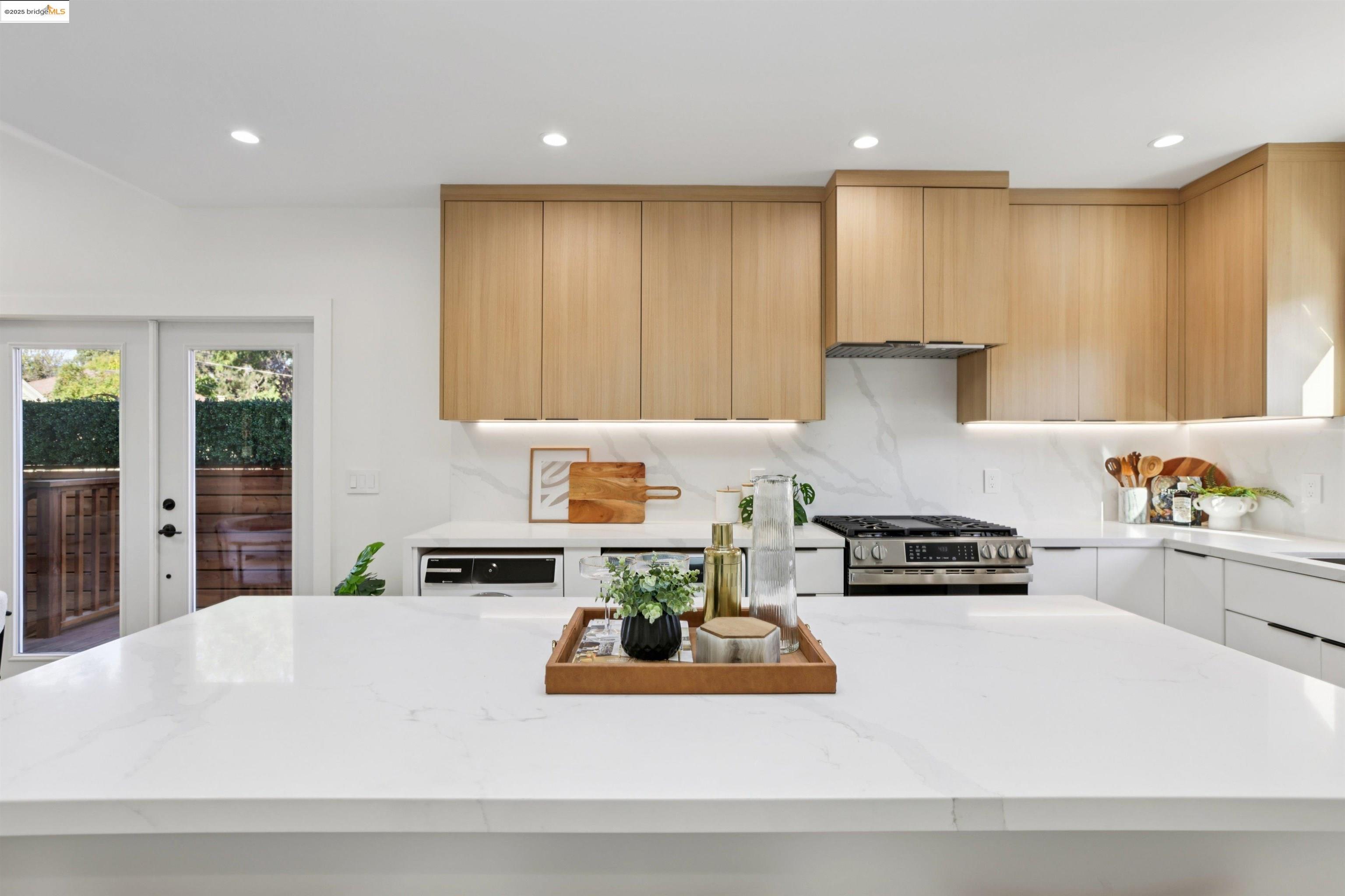 1612 Carleton Street Berkeley, CA 94703 - Photo 18 of 35 a kitchen with counter top space cabinets and stainless steel appliances