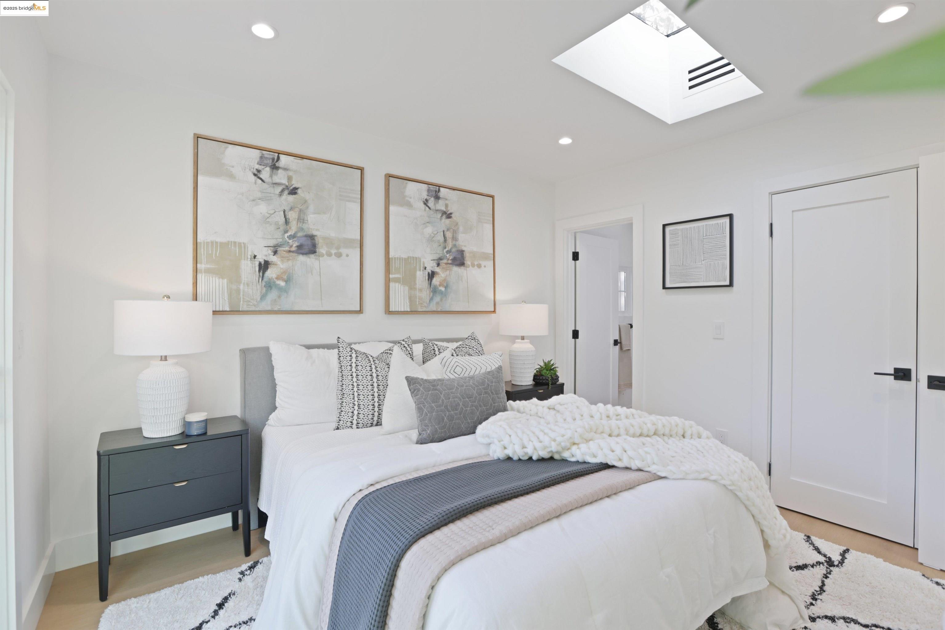 1612 Carleton Street Berkeley, CA 94703 - Photo 21 of 35 a bedroom with a bed and a painting on the wall