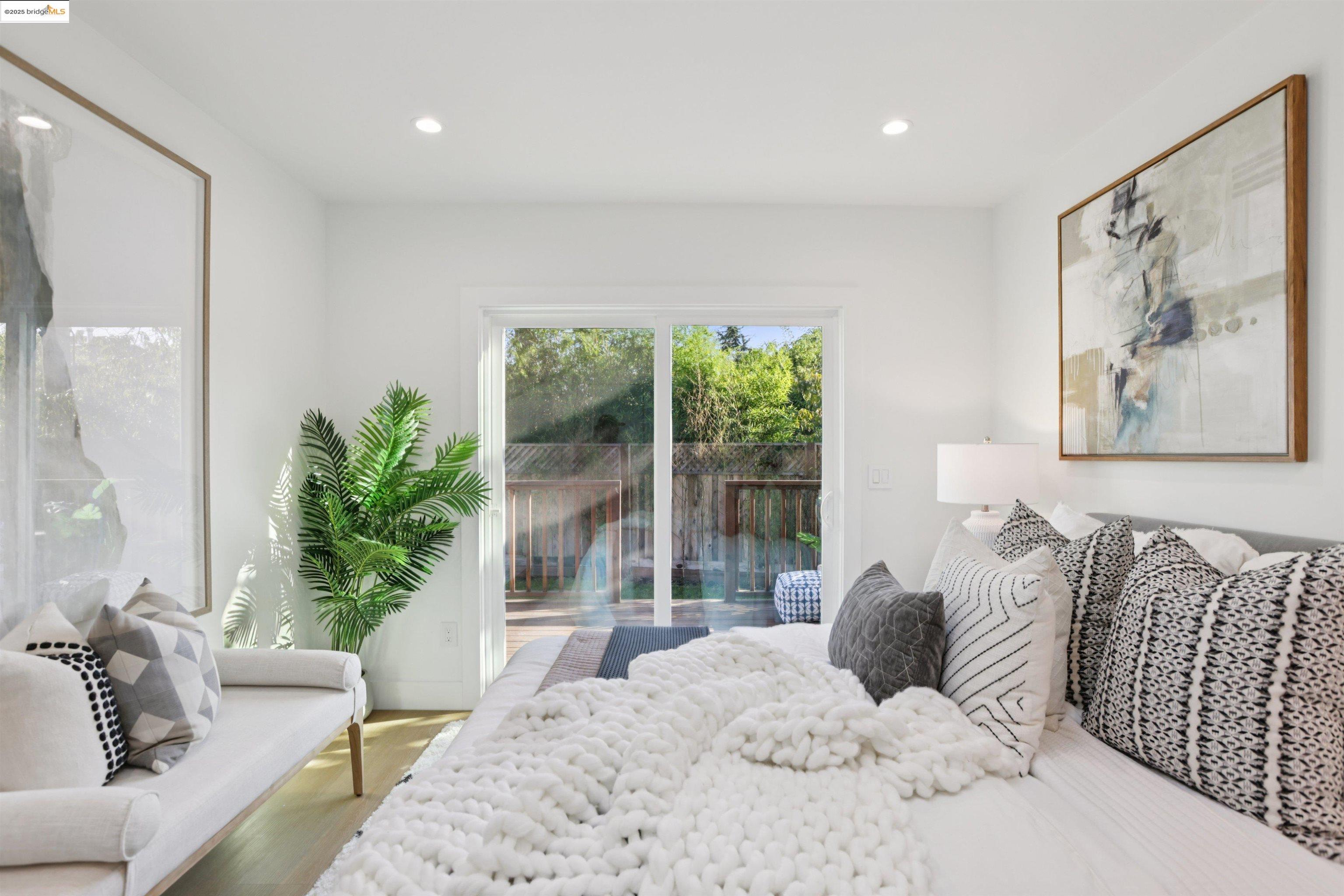 1612 Carleton Street Berkeley, CA 94703 - Photo 22 of 35 a bedroom with a large bed and a large window