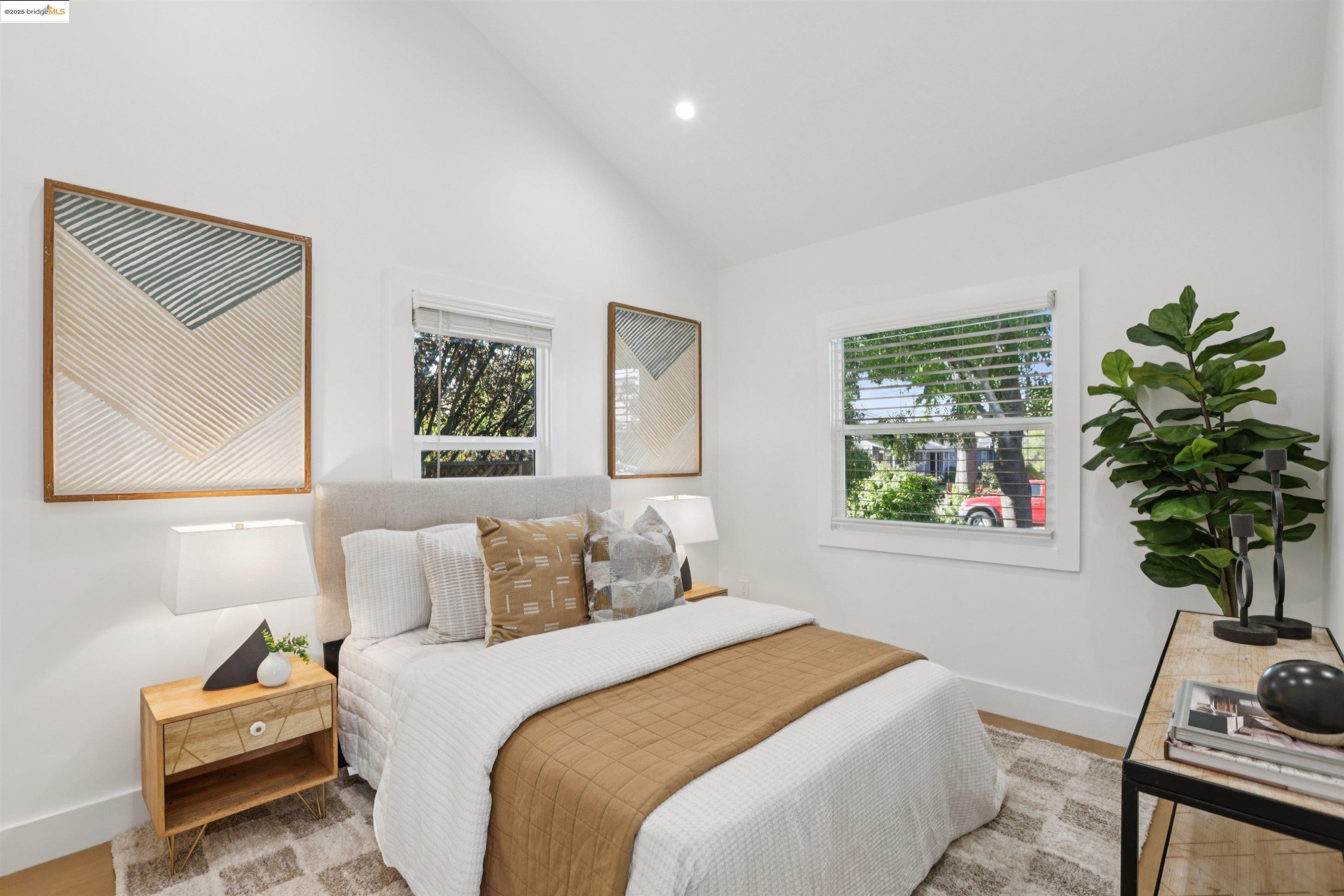 1612 Carleton Street Berkeley, CA 94703 - Photo 24 of 35 a bedroom with bed and a potted plant