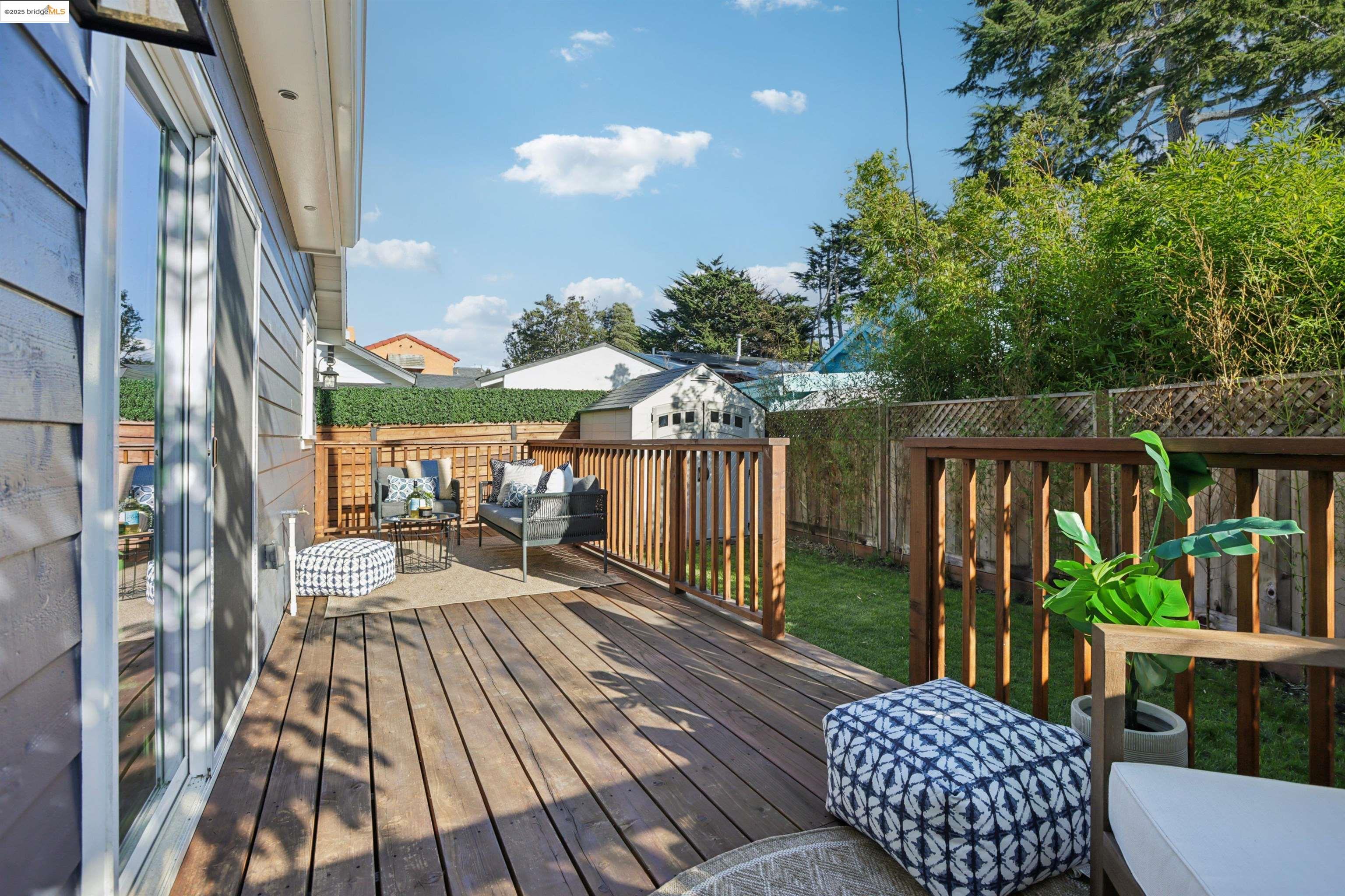 1612 Carleton Street Berkeley, CA 94703 - Photo 27 of 35 a view of a patio with couches table and chairs and potted plants