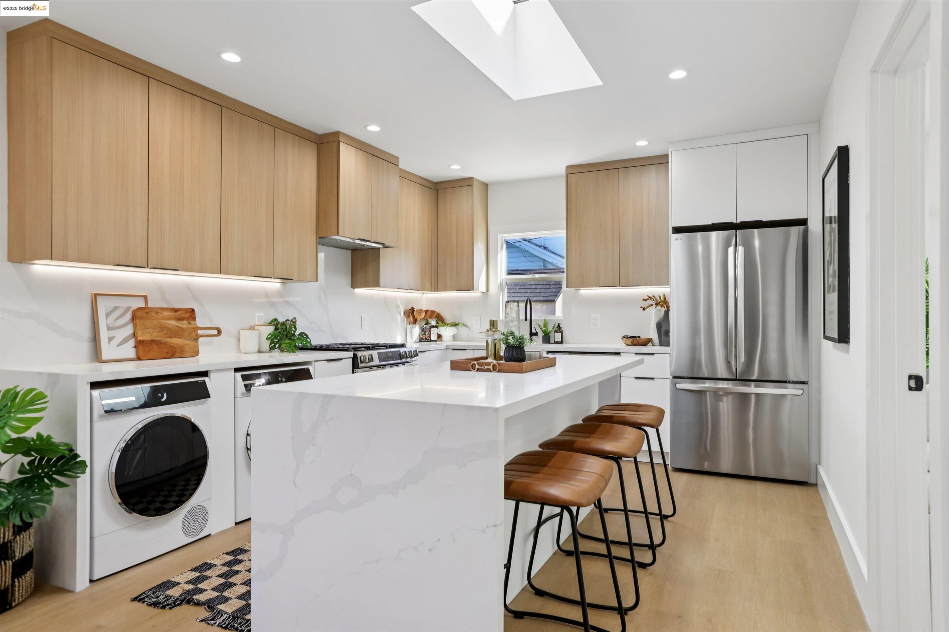 1612 Carleton Street Berkeley, CA 94703 - Photo 10 of 35 a kitchen with a refrigerator a stove top oven a sink and cabinets
