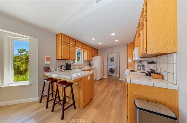 a bedroom with two beds and a chandelier