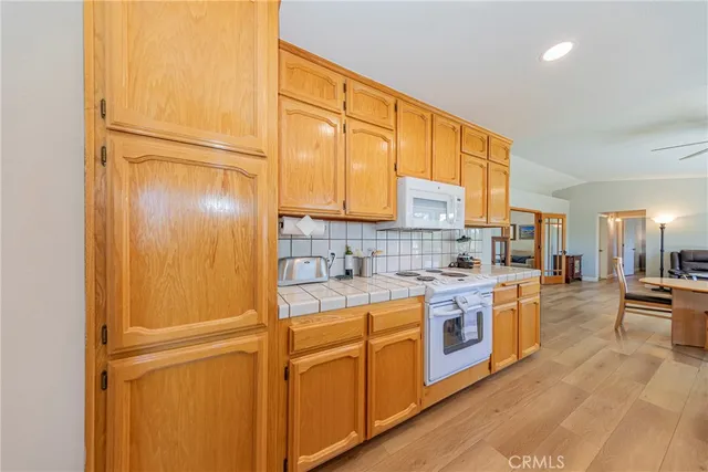 a bedroom with a bed and a ceiling fan