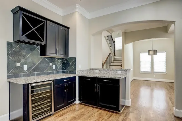 a kitchen with stainless steel appliances granite countertop a stove and a sink