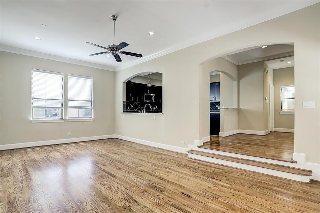 1601 West 24th Street, Unit A Houston, TX 77008 - Photo 13 of 28 a view of an empty room with window and wooden floor