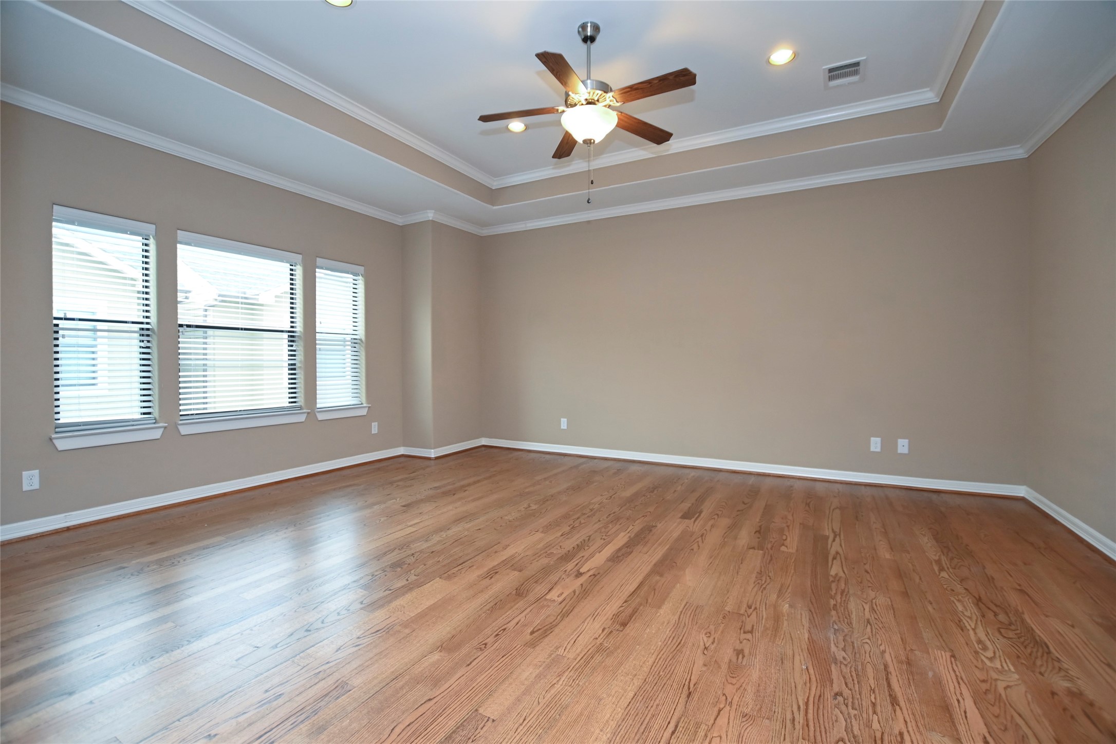 1601 West 24th Street, Unit A Houston, TX 77008 - Photo 19 of 28 wooden floor in an empty room with a window