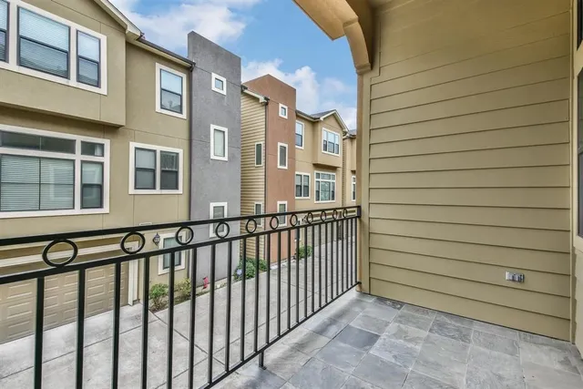 a view of a brick building next to a street