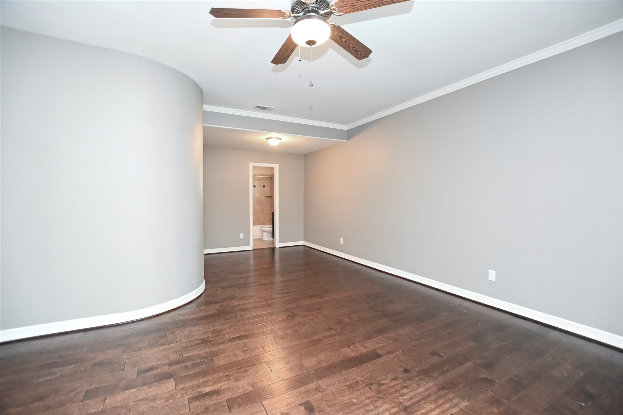 1601 West 24th Street, Unit A Houston, TX 77008 - Photo 5 of 28 wooden floor in an empty room with a window