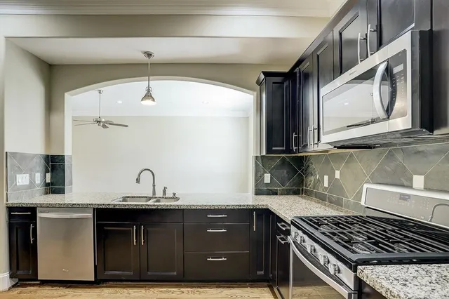 a kitchen with a sink and cabinets