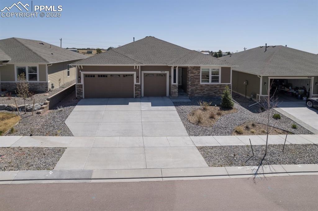 9257 Bugaboo Dr. Colorado Springs, CO 80924 - Photo 1 of 46 front view of a house with table