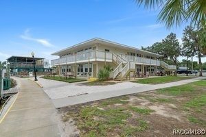5291 South Cherokee Way Homosassa, FL 34448 - Photo 2 of 27 a front view of a building with garden