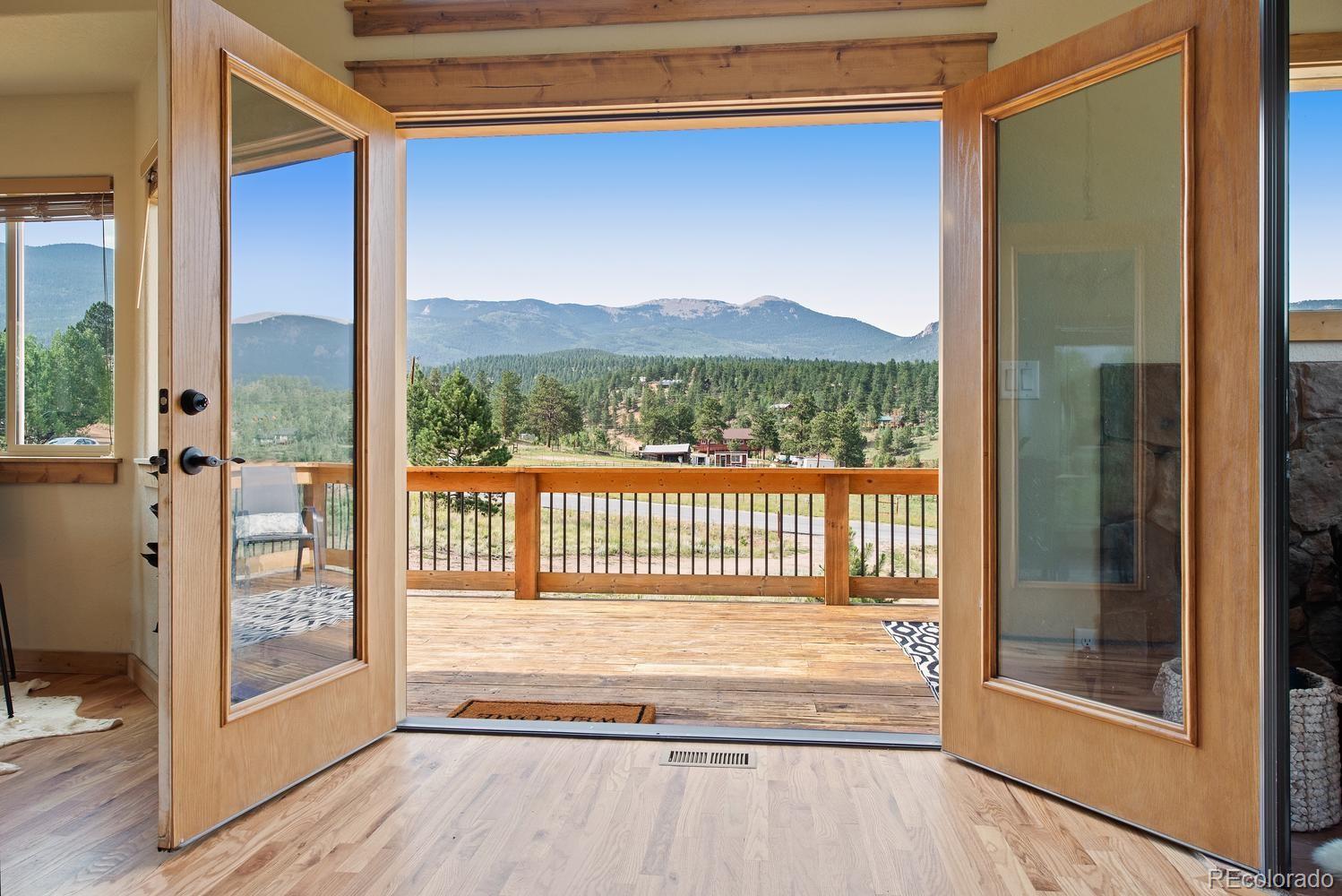 1328 Clark Road Bailey, CO 80421 - Photo 16 of 37 a view of balcony with a floor to ceiling window