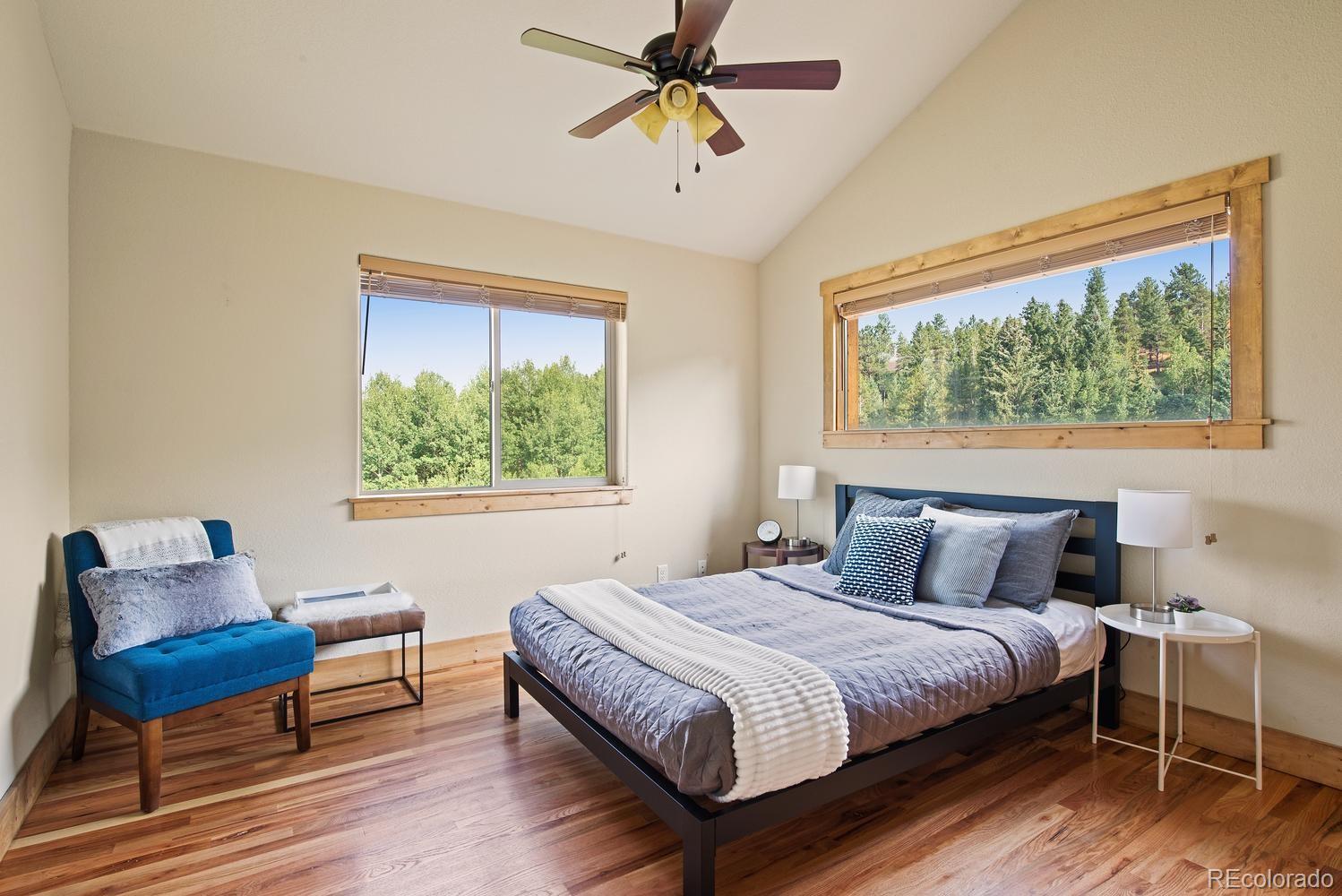 1328 Clark Road Bailey, CO 80421 - Photo 26 of 37 a bedroom with a bed and a couch