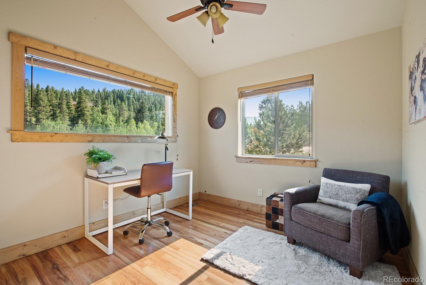 1328 Clark Road Bailey, CO 80421 - Photo 30 of 37 a living room with furniture and a window