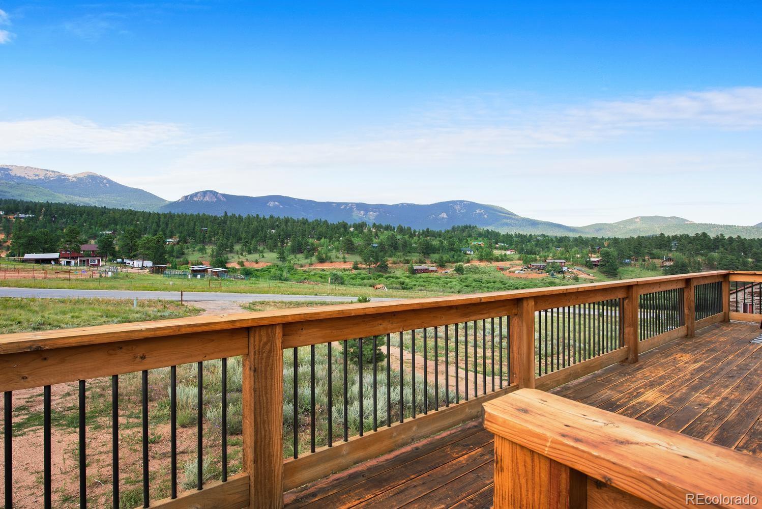 1328 Clark Road Bailey, CO 80421 - Photo 3 of 37 a view of a city from a balcony