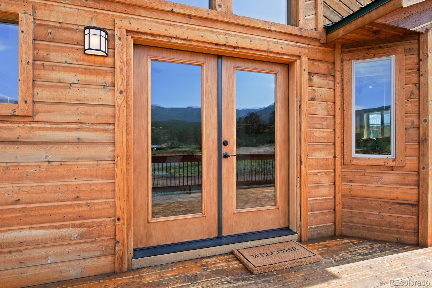 1328 Clark Road Bailey, CO 80421 - Photo 9 of 37 a view of a door of the house with a door