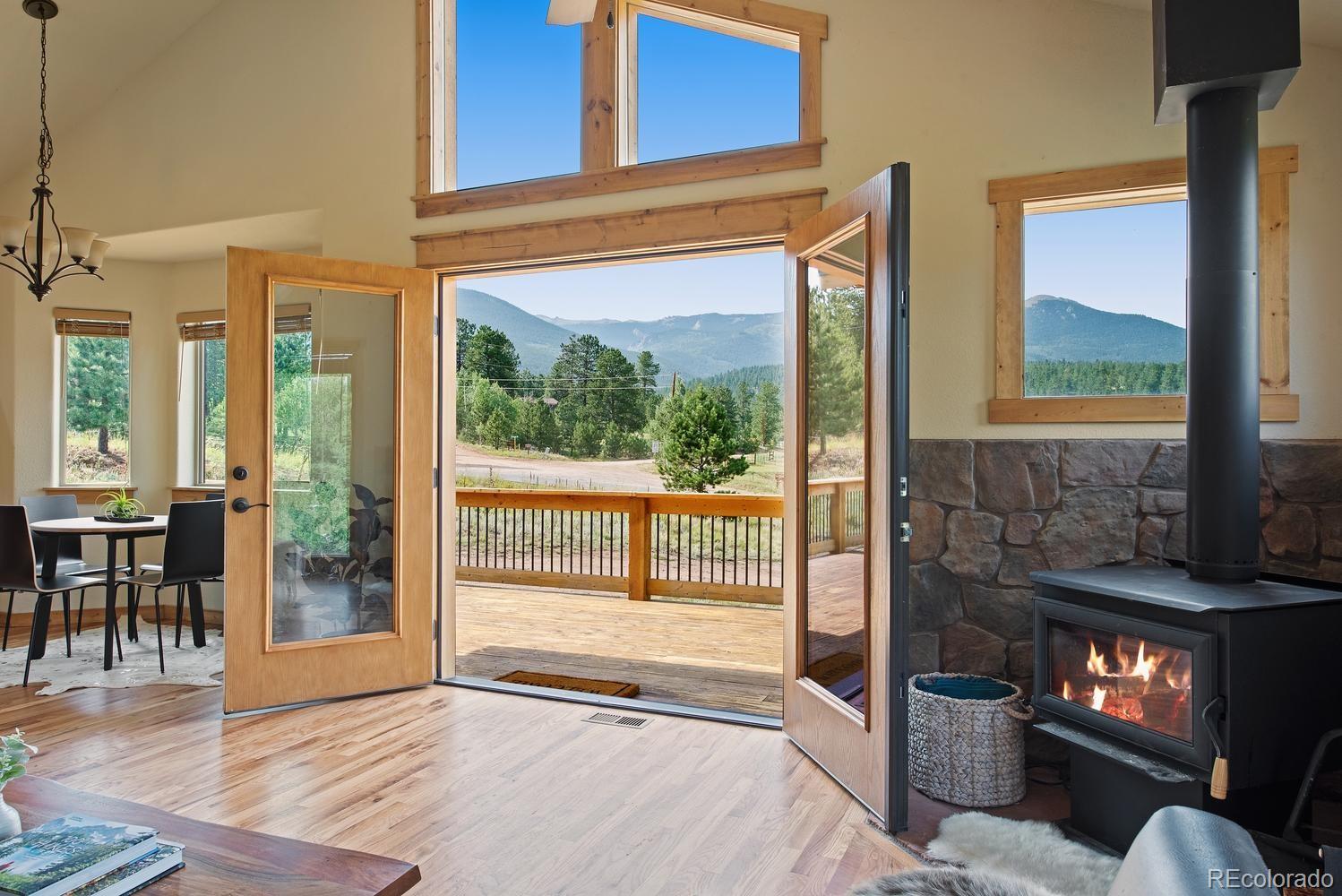1328 Clark Road Bailey, CO 80421 - Photo 10 of 37 a view of an entryway and livingroom with furniture