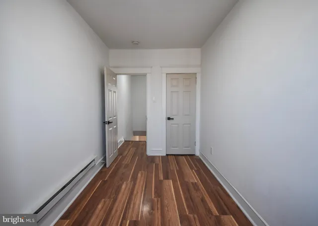 a view of wooden floor in a bathroom