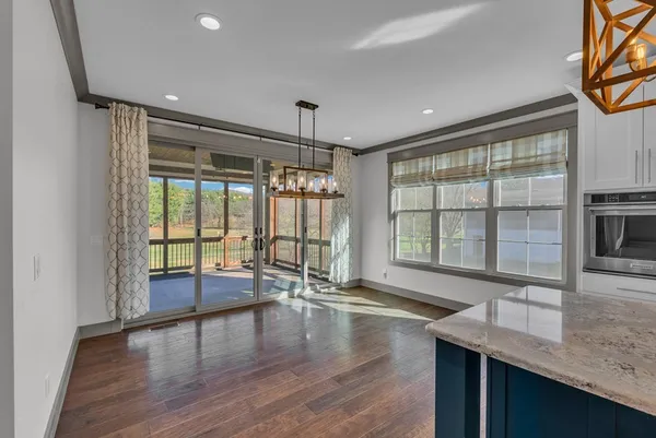 a view of an entryway with wooden floor