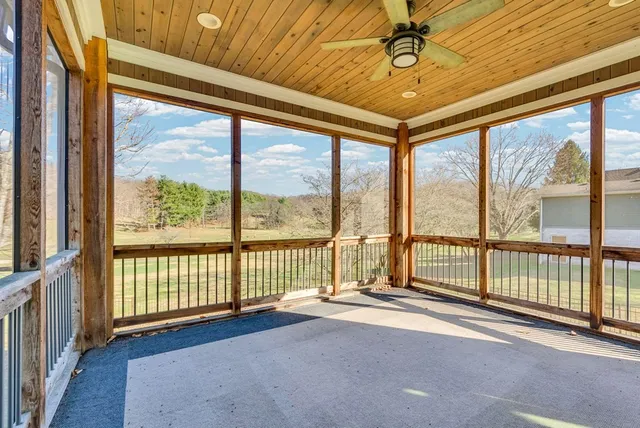 a view of an empty room with windows