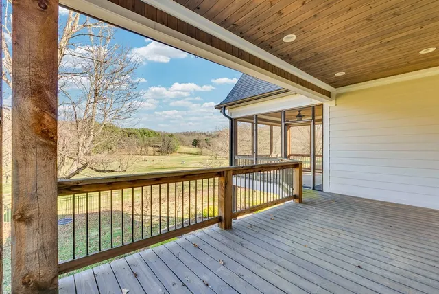 a view of balcony with wooden floor