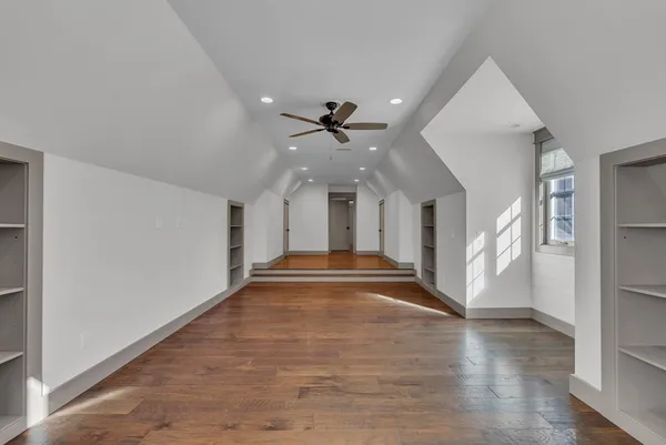 a view of interior space with wooden floor and window