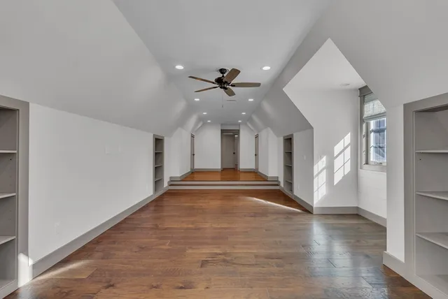 a view of interior space with wooden floor and window
