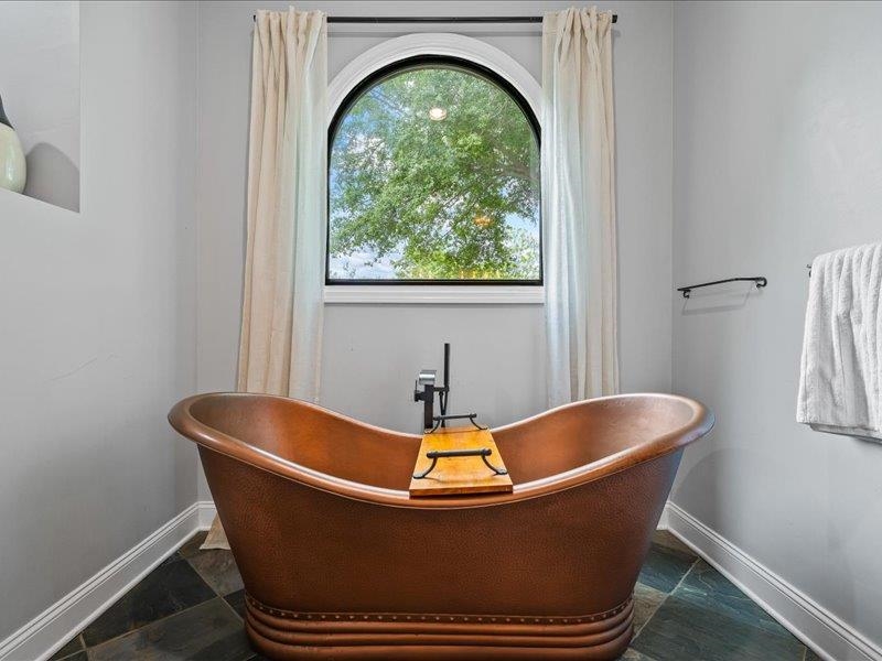 8104 Jack Bond Road Arlington, TN 38002 - Photo 18 of 40 a white tub sitting in a bathroom