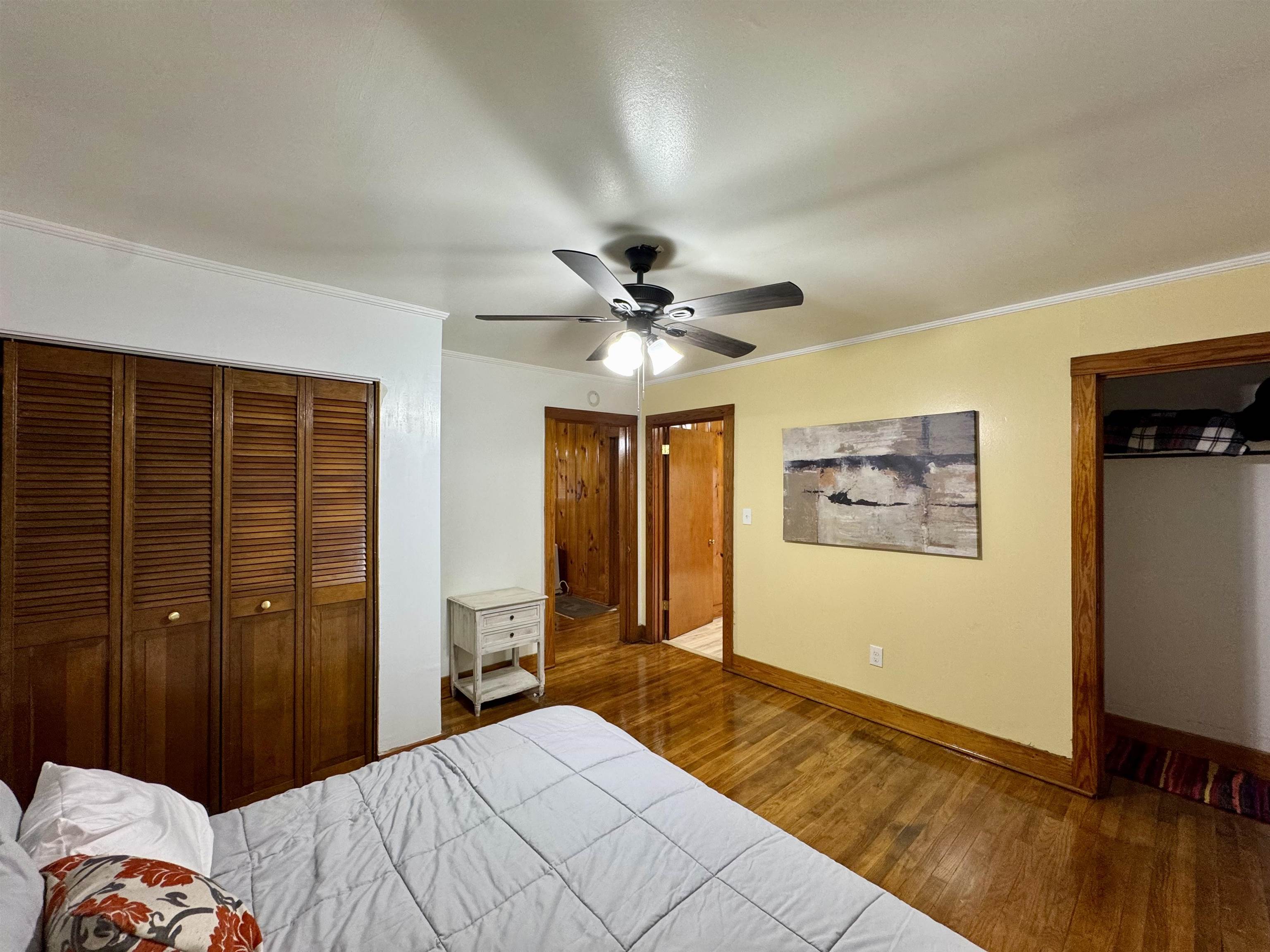 624 Fyfe Street Covington, TN 38019 - Photo 13 of 15 a bedroom with a bed and a chandelier