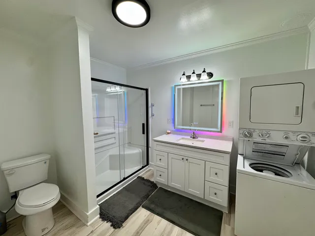 a bedroom with a bed and a bathroom